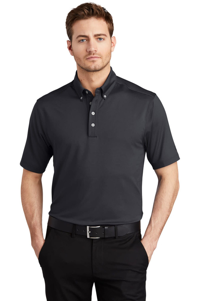 A black OGIO Gauge Polo shirt with a collar and buttons, featuring a logo on the chest.