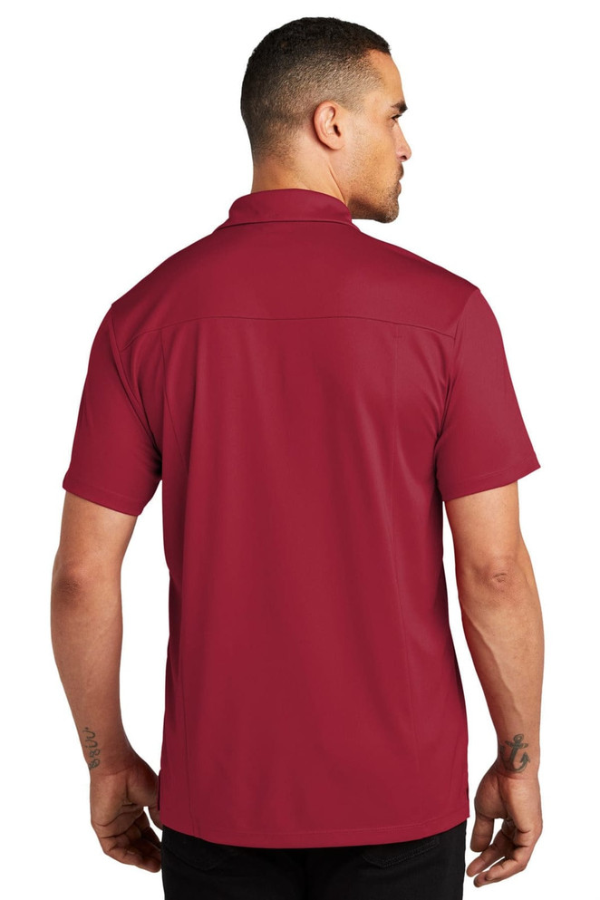 A burgundy polo shirt from the back, featuring a collar and a logo on the shoulder.