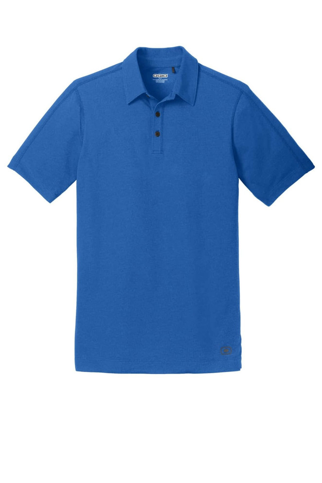 A blue OGIO Onyx Polo shirt with a collared neck and three-button placket, featuring a logo.