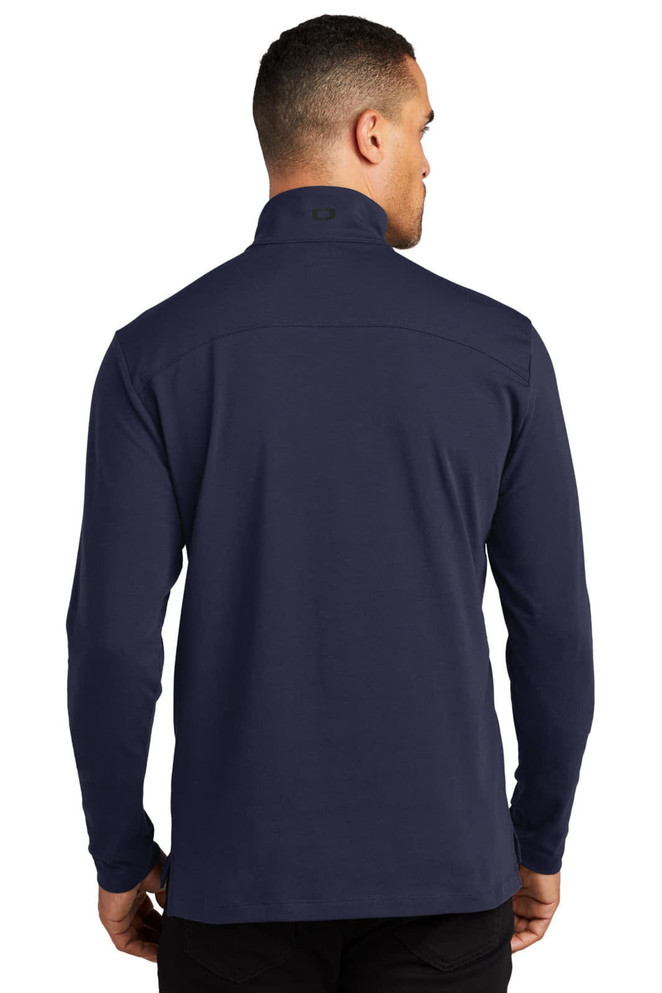 A navy blue OGIO Limit 1/4-Zip jumper featuring a high collar and a smooth finish, with a logo on the back.