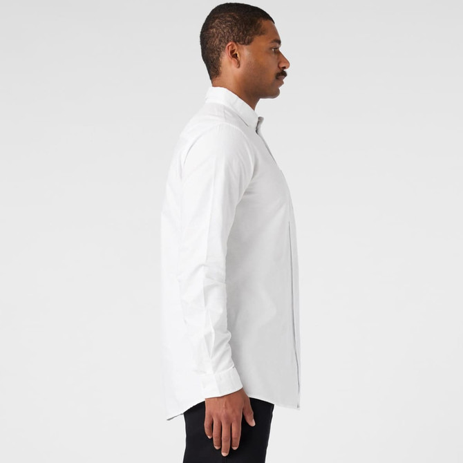 A white button-up Oxford shirt displayed on a model in a side profile view, featuring a collar and long sleeves.