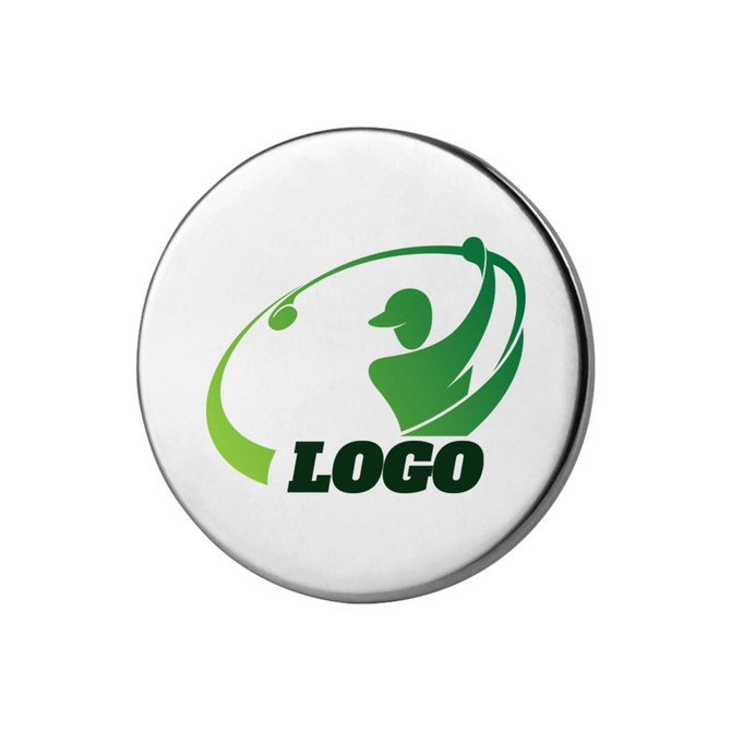 A round, silver ball marker with a green logo featuring a golfer in action.