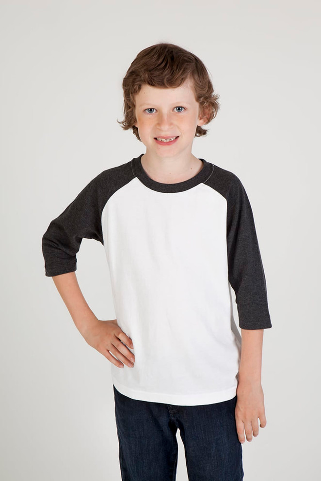 A child's 3/4 raglan sleeve T-shirt featuring a white body and dark grey sleeves, modelled by a smiling boy.