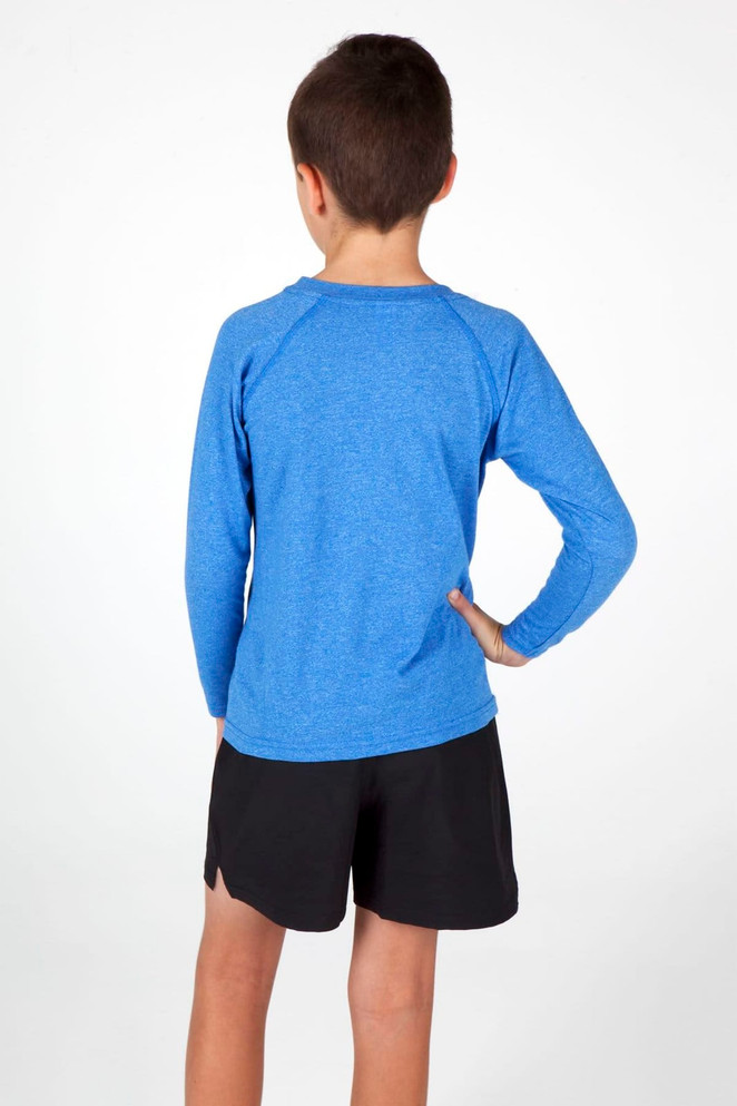 A blue long sleeve T-shirt with a raglan design, worn by a child, paired with black shorts.