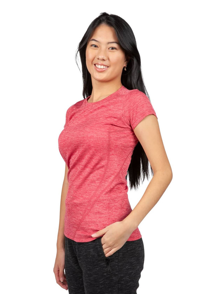 A woman is wearing a red 100% polyester T-shirt, featuring short sleeves and a relaxed fit, with a logo visible.