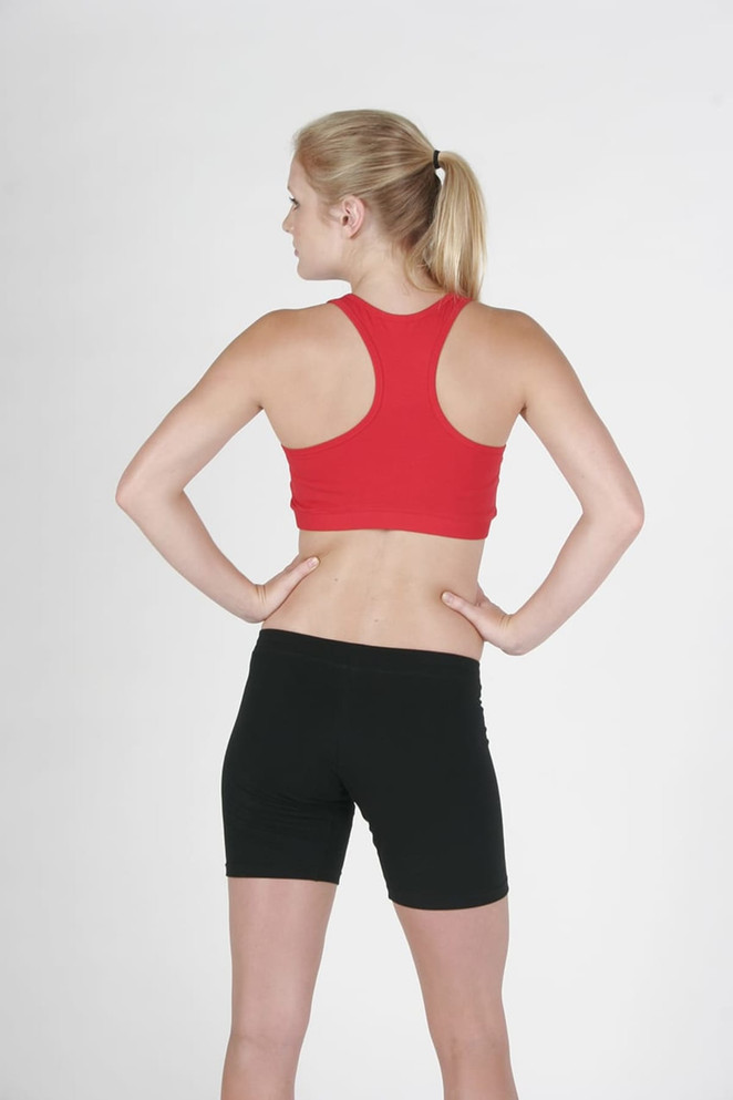 A red sports crop top with a racerback design, paired with black shorts, displaying a sporty look from the back.