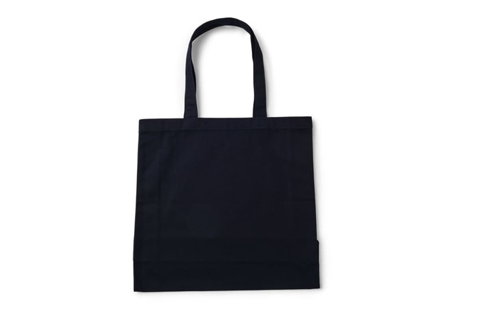 A heavy black tote bag with dual handles and a simple design, featuring a logo on the front.