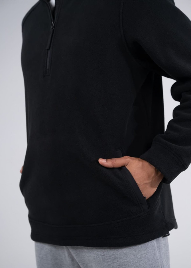 A black polar fleece half zip top with side pockets, featuring a logo. Ideal for casual wear.