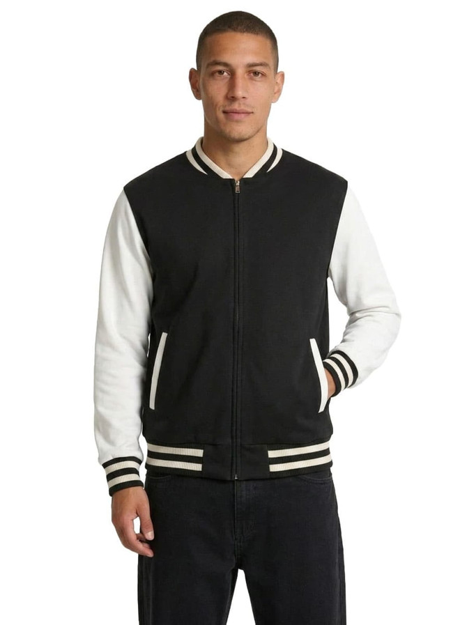 A men's/unisex varsity jacket in black with white sleeves and striped cuffs. Features side pockets and a zip closure.