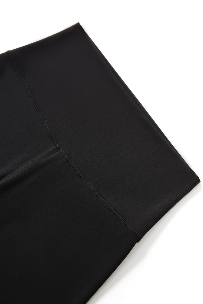 Black high rise legging shorts with a smooth waistband and sleek finish. Features a logo on the waistband.