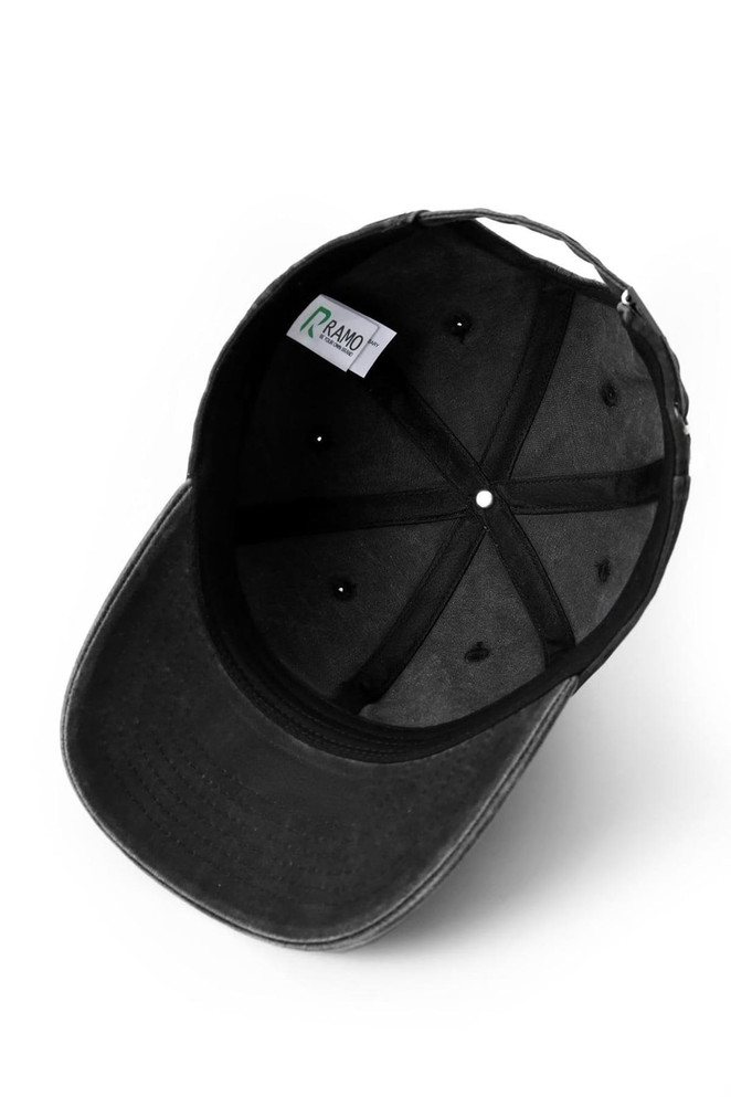 An unstructured black cotton drill cap with an internal label and ventilation holes.
