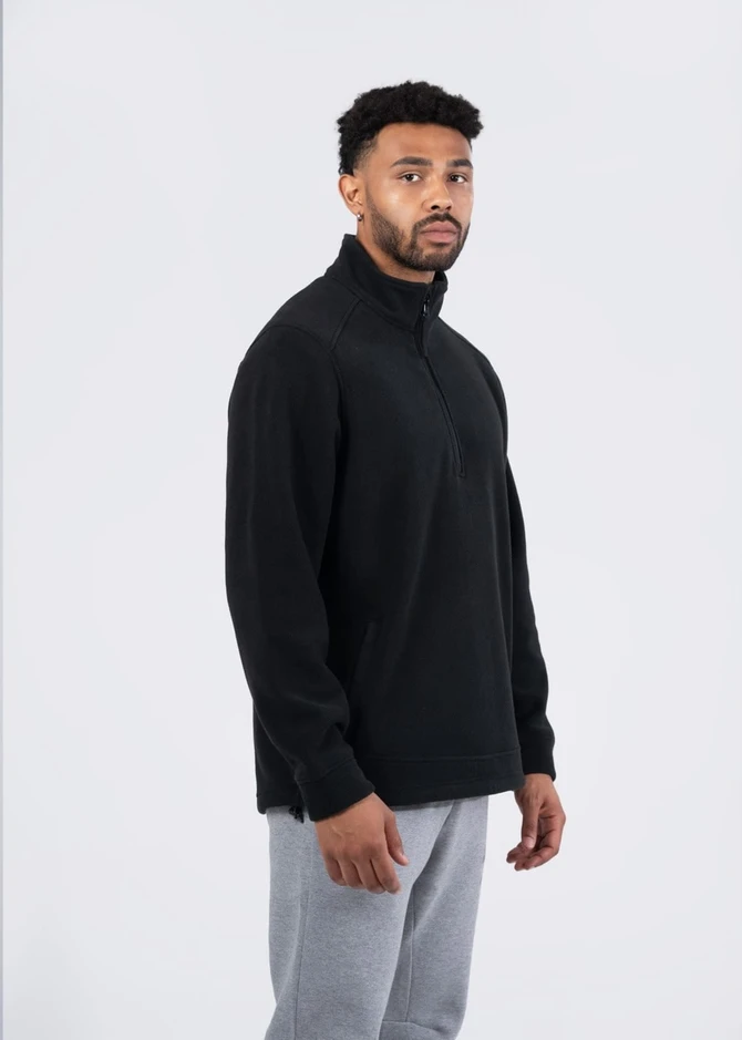 A black men's/unisex polar fleece half zip top is displayed on a model against a plain background.