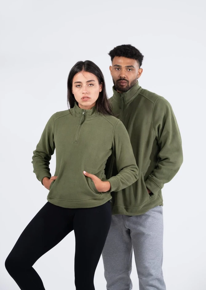 A green polar fleece half zip top worn by a man and woman, featuring pockets and a logo.