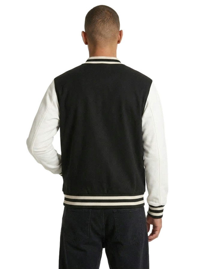 A men's unisex wool blend varsity jacket in black and white, featuring contrasting sleeves and a branded logo.