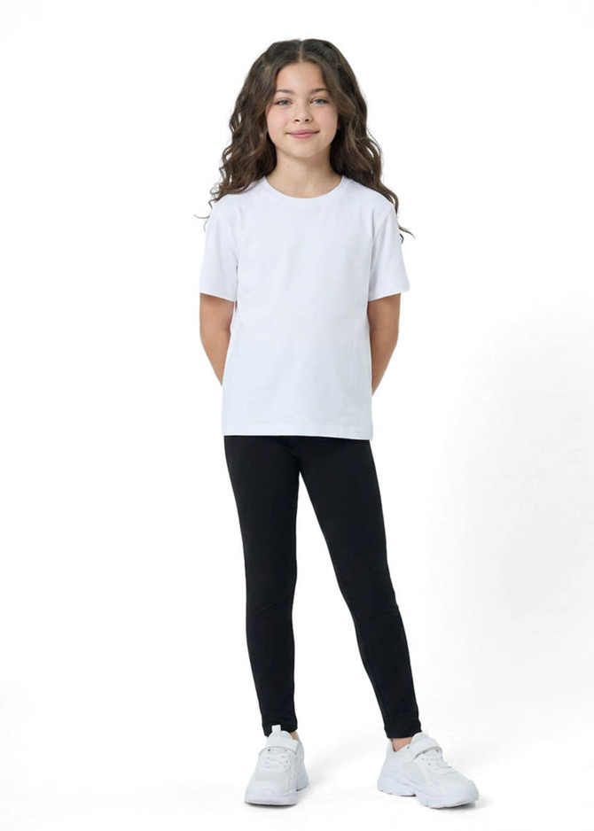 Kids' black leggings paired with a white t-shirt, featuring a logo on the shirt, worn by a girl with curly hair.