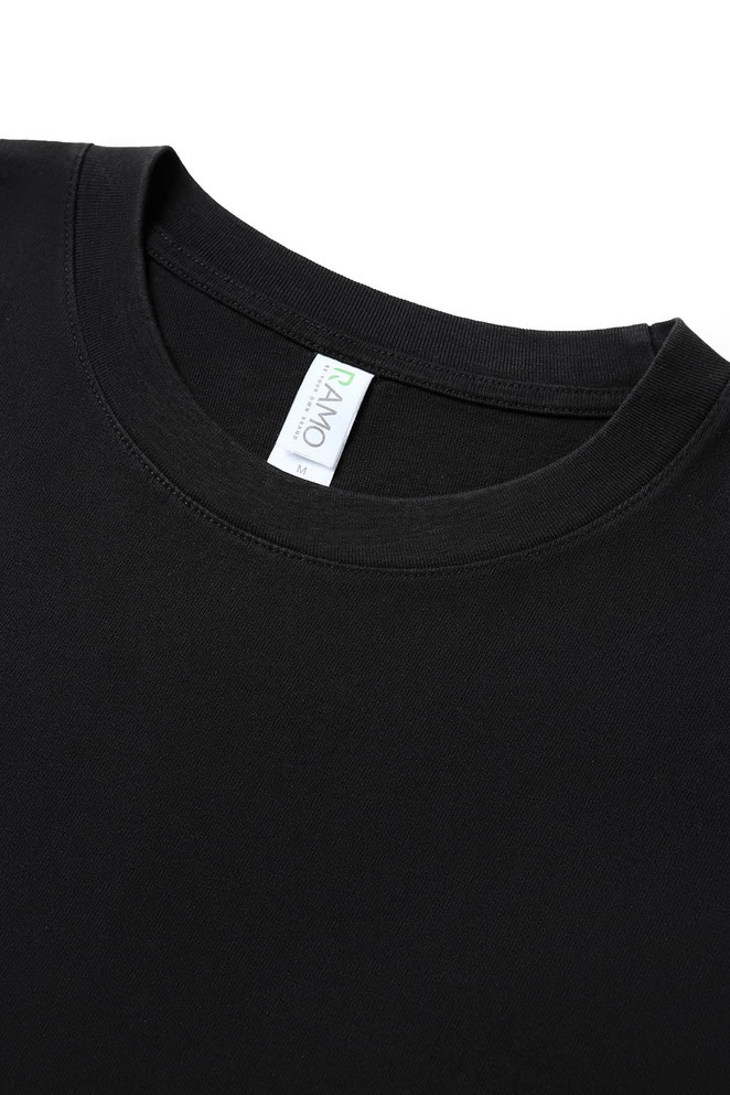 A black oversized T-shirt made from 230gsm 100% organic cotton, featuring a simple neckline and a label.