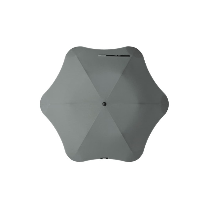 A grey umbrella with a unique shape, featuring a central button and a simple, modern design.