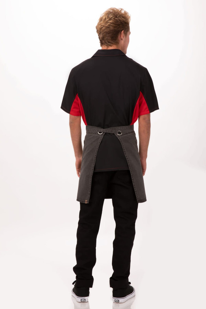 A black and grey bistro apron worn by a person, with a red shirt visible from the back. Features a logo.