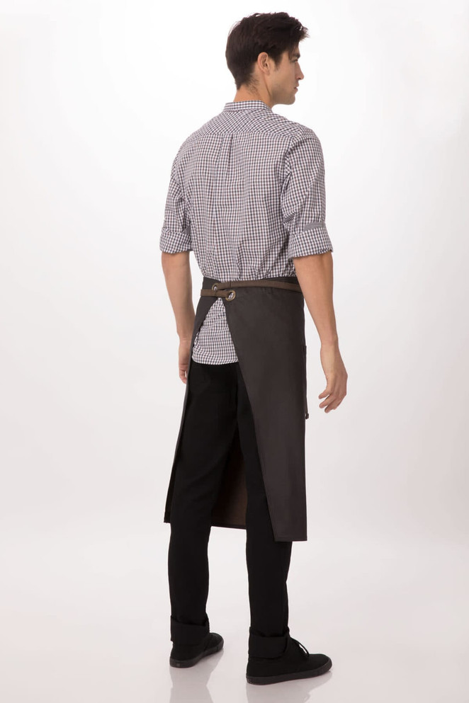 A man wearing a black Boulder Bistro apron over casual attire, showcasing the back of the apron.