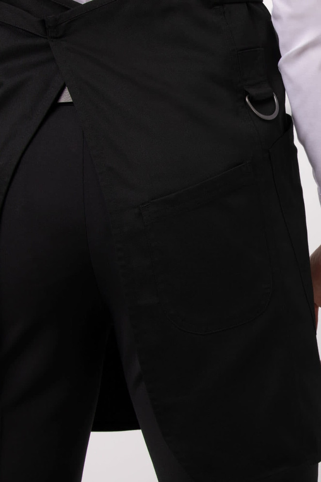 A black Largo Bib Apron with a pocket and a ring detail on the side, showcasing its workwear design.