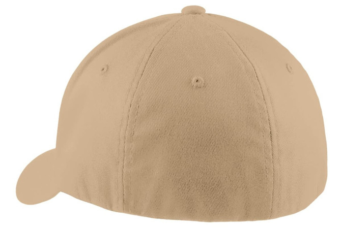 A beige Port Authority Flexfit Cap featuring a seamless front and a curved peak, with a logo on the side.