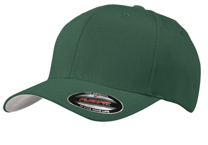 A green Port Authority Flexfit cap with a fitted design and a branded tag on the front.