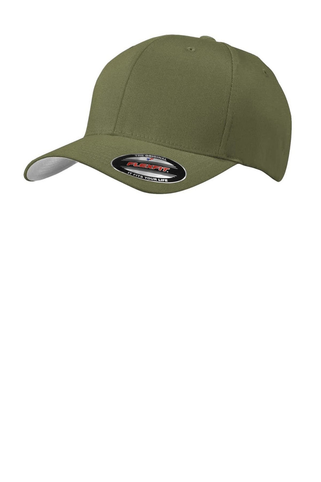 A green Port Authority Flexfit cap with a curved brim and a logo on the front.