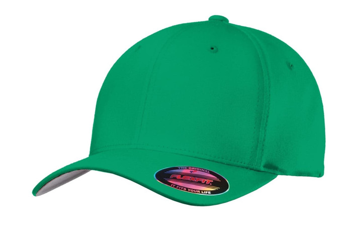 A green Flexfit cotton twill cap featuring a curved brim and a logo on the side.