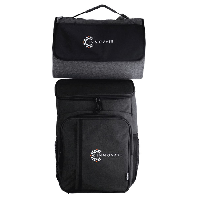 A black and grey picnic backpack featuring a logo, with a detachable insulated cooler on top.