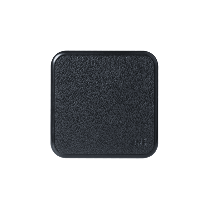 A black wireless charger with a textured surface and rounded edges, featuring a logo on the side.