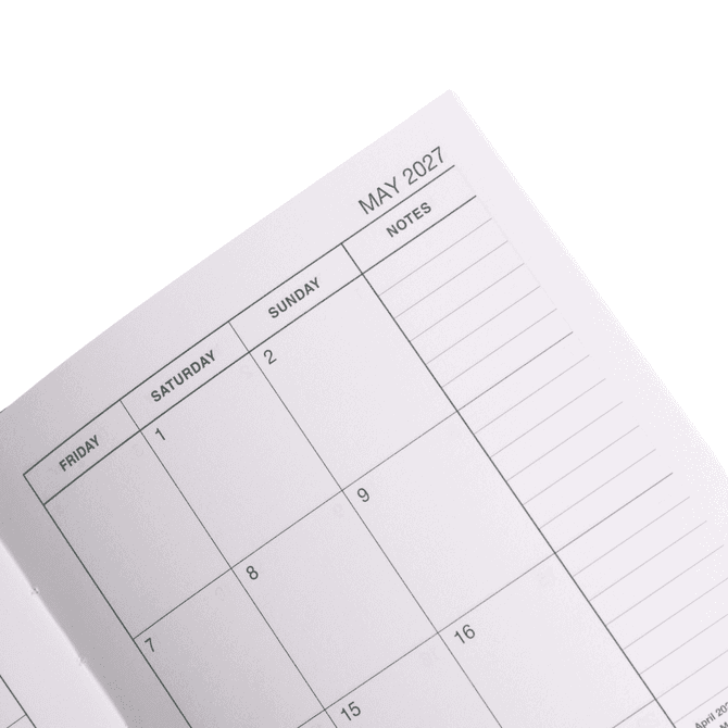 An open A5 diary featuring a monthly layout for May 2027, with blank spaces for each day and notes.