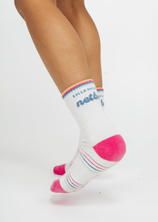 Custom branded kids' socks in white with pink and blue accents, featuring a logo on the ankle.