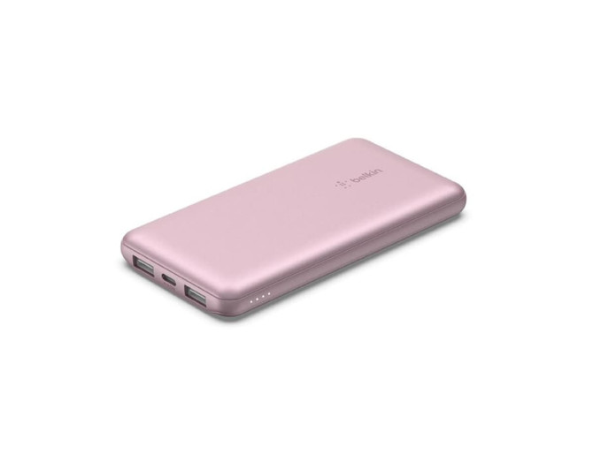 A pink power bank with two USB ports and a USB-C port, featuring indicator lights and a smooth finish.