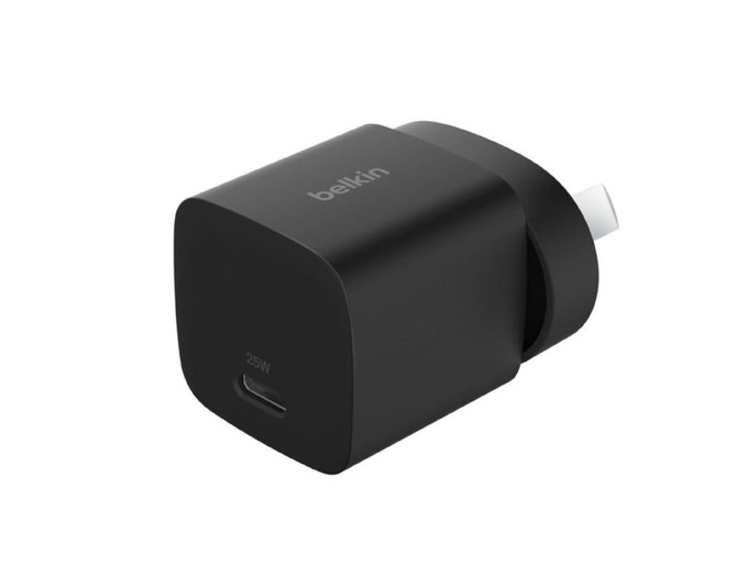 A black Belkin 25W wall charger with a USB-C port and a logo. Compact and rectangular in shape.