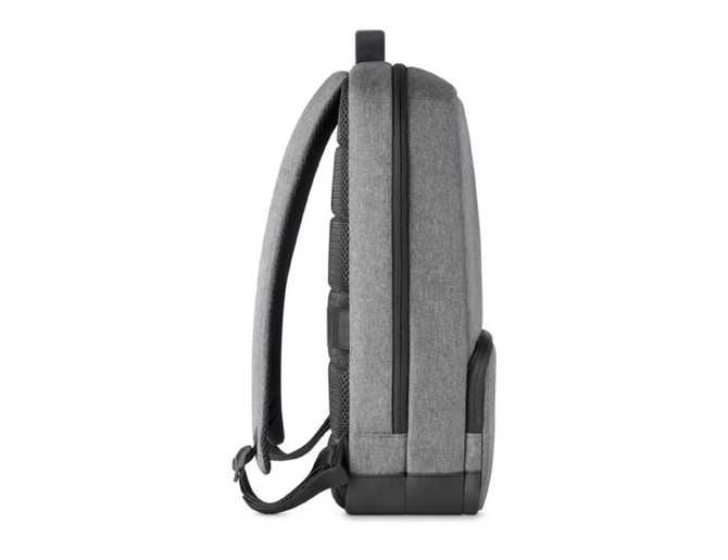 A grey backpack with padded straps and textured side panels, featuring a sleek, modern design.