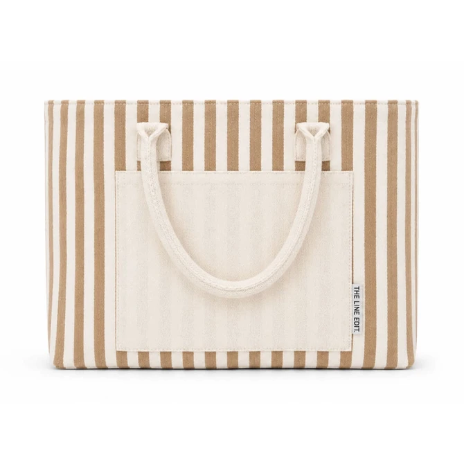A striped tote bag with a cream and brown pattern, featuring two handles and a front pocket.