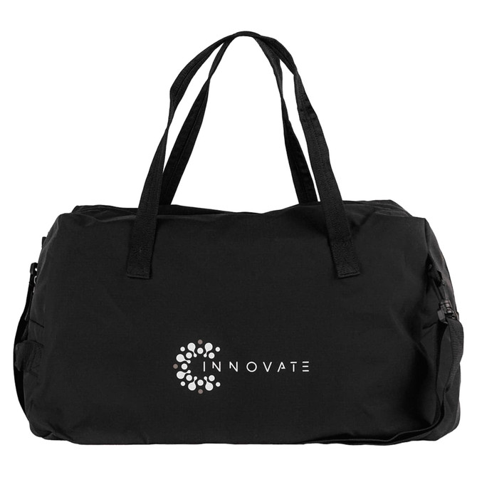 A black duffel bag with dual handles and a logo on the front, featuring side zip compartments.