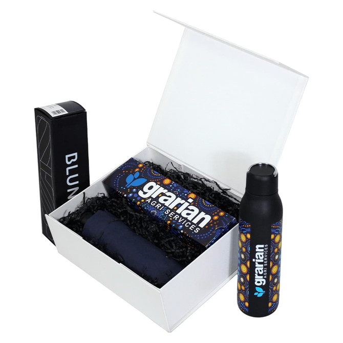 A white magnetic gift box containing a drink bottle, a black item, and a folded item with a logo.