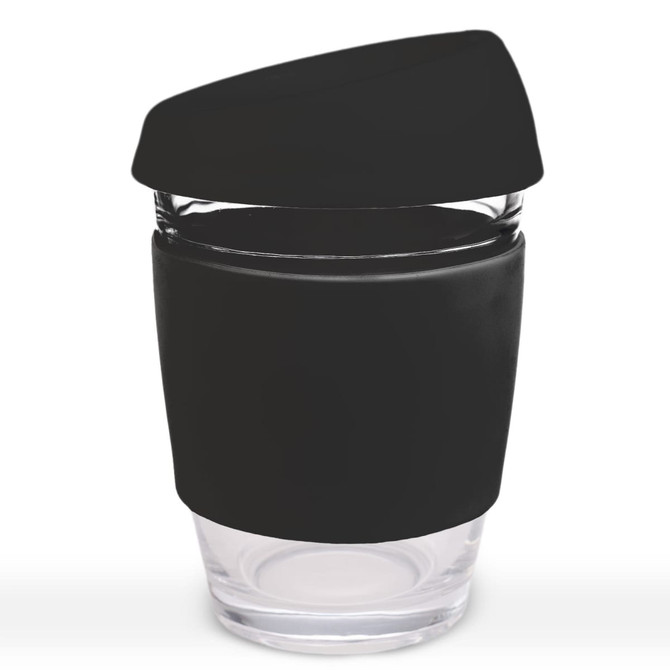 A reusable coffee cup with a transparent glass body and a black silicone lid and sleeve.