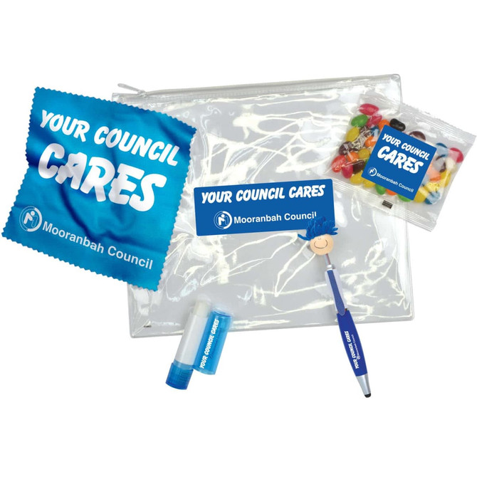 An intro pack containing a clear pouch, lip balm, a pen, and a snack bag with colorful jelly beans.