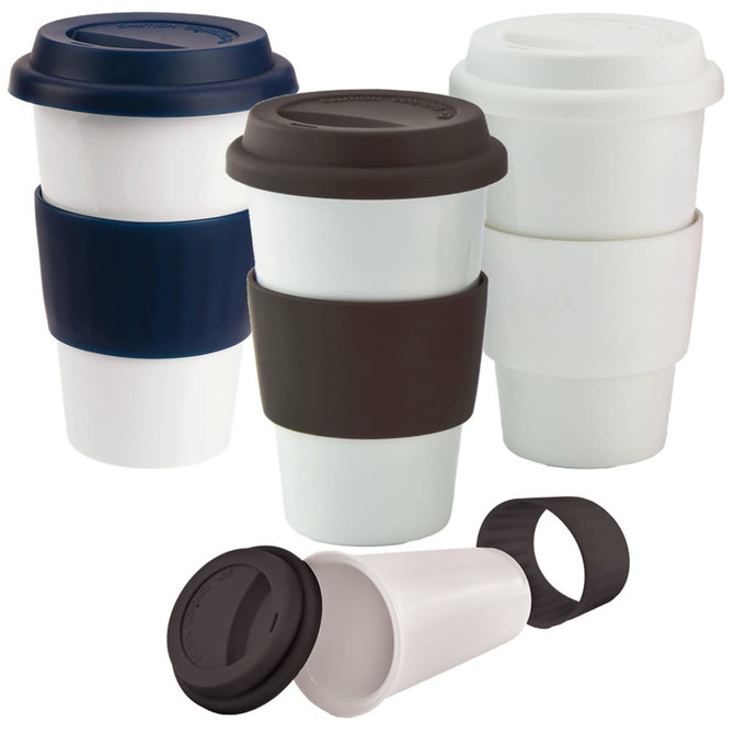 A ceramic coffee mug set featuring white and dark-coloured mugs with silicone sleeves and lids for heat protection.