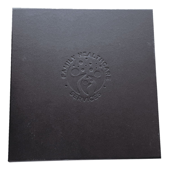 A black box with an embossed logo featuring a family and the words "Family Healthcare Services."