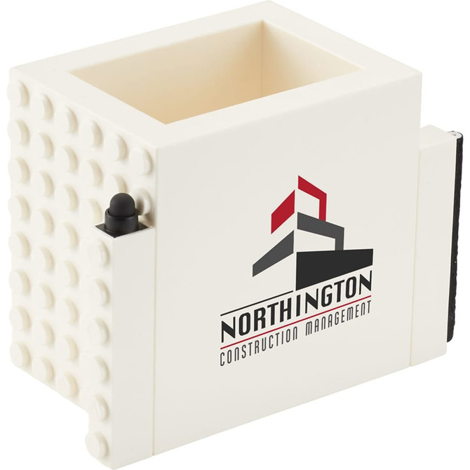 A cream-coloured pen pot with a textured surface and a branding logo on the front.