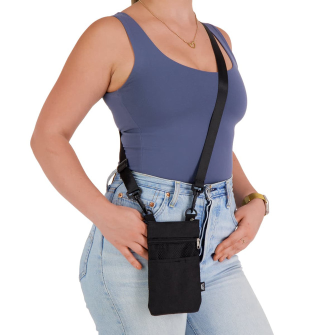 A black neck pouch worn crossbody, featuring multiple pockets, with a model dressed in casual attire.