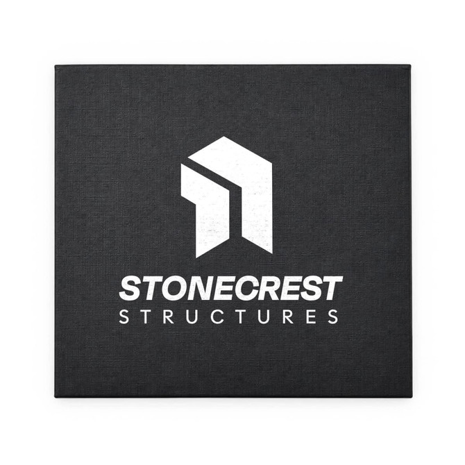 A black canvas featuring a white logo with geometric shapes and the text "Stonecrest Structures" beneath it.