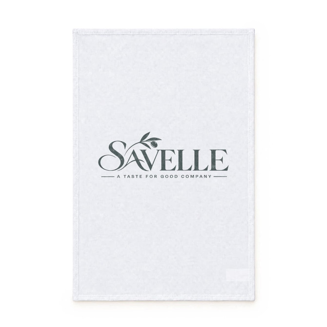 A white cotton tea towel with a logo and a simple design featuring a leafy branch.