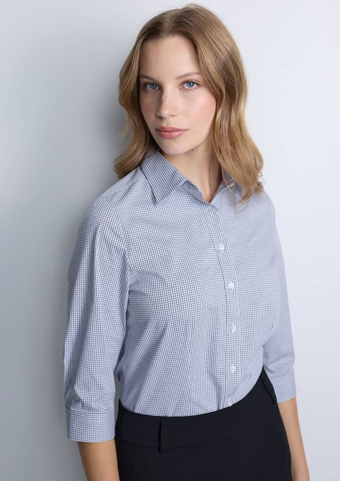 A women's 3/4 sleeve shirt in a blue and white check pattern, featuring a collar and button front.