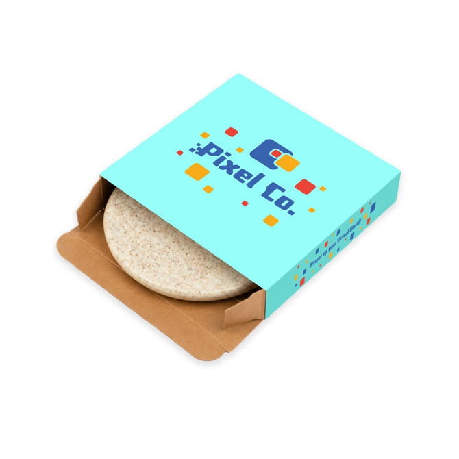 A round eco wireless charger in a beige hue, presented in a colourful branded box with various geometric shapes.