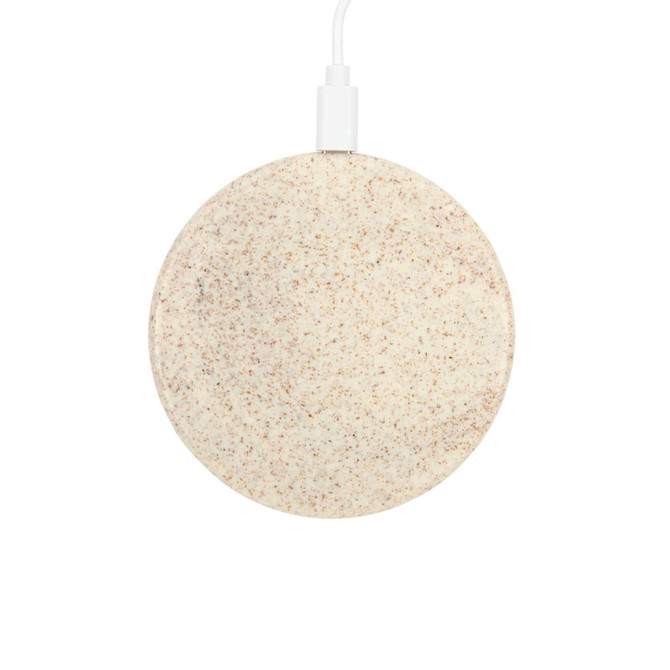 A circular, eco-friendly wireless charger in a speckled beige colour, connected by a white charging cable.