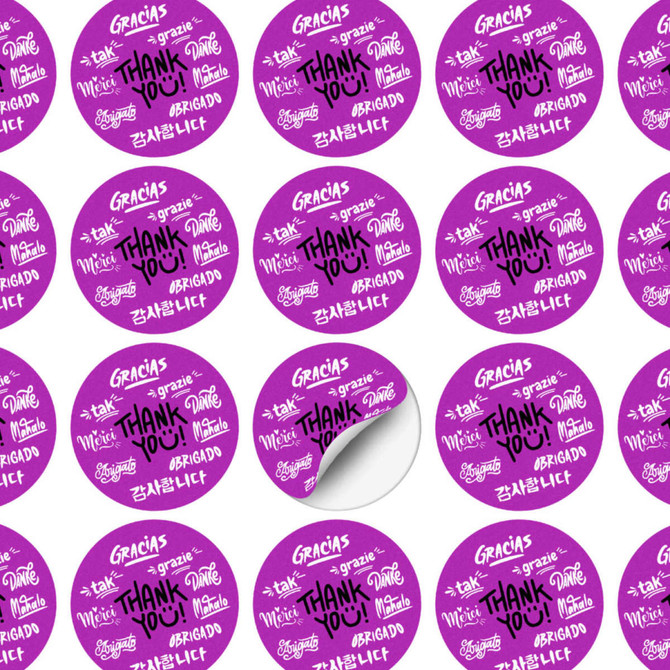 A sheet of circular stickers featuring a purple background with various thank you messages in multiple languages. A sheet of circular stickers featuring a purple background with various thank you messages in multiple languages.
